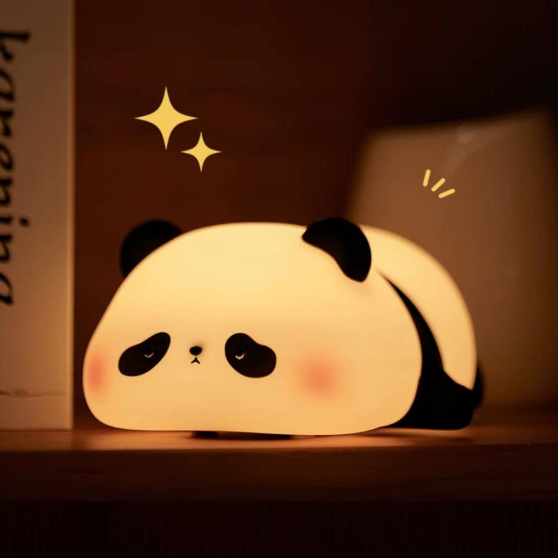 Illustration of a lying panda night light in black and white with a sleeping expression.